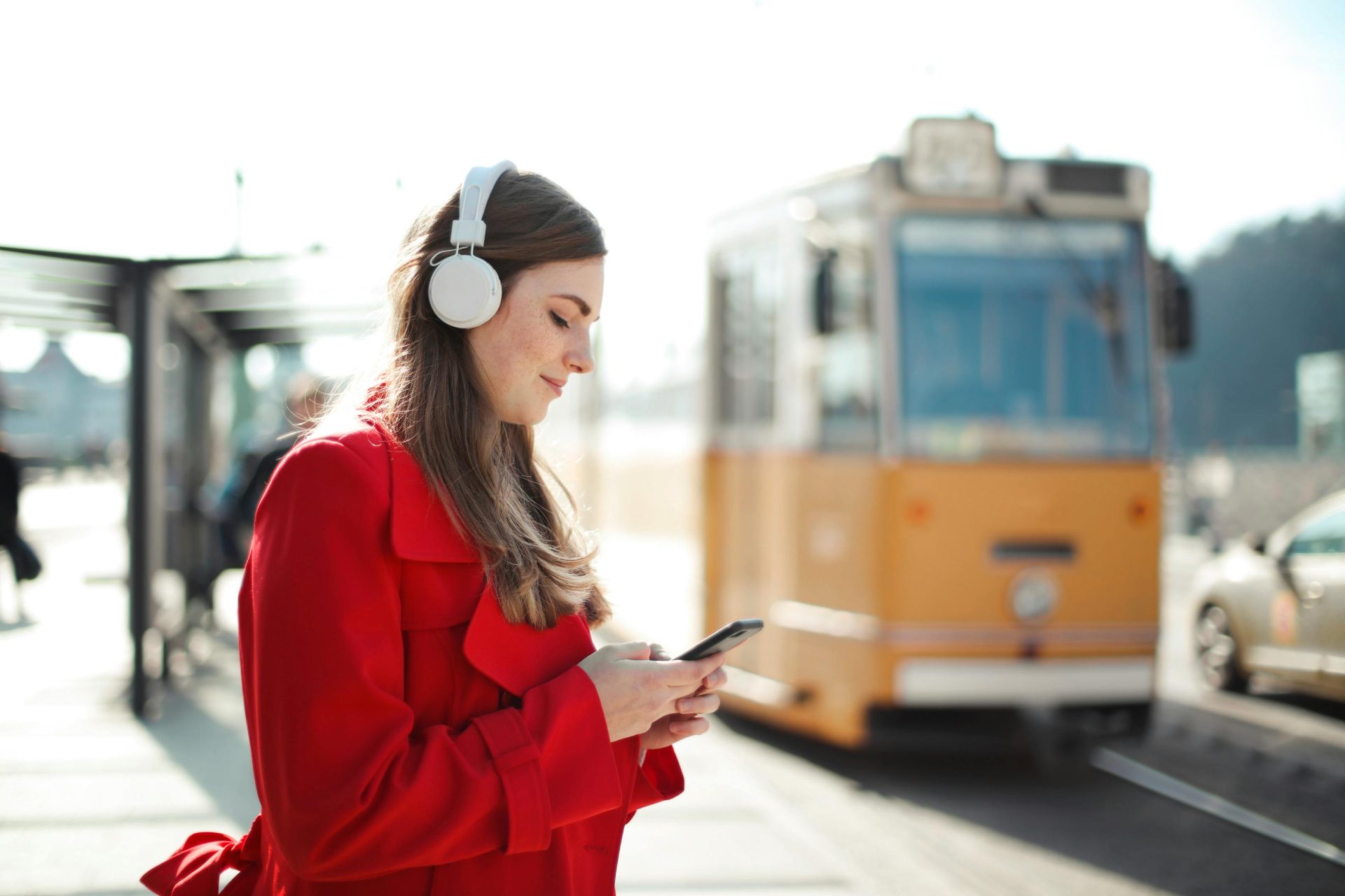 Woman in red coat listening